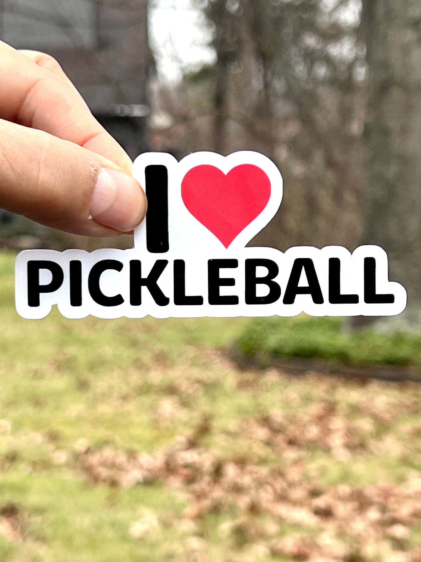 A sticker that says I Heart Pickleball