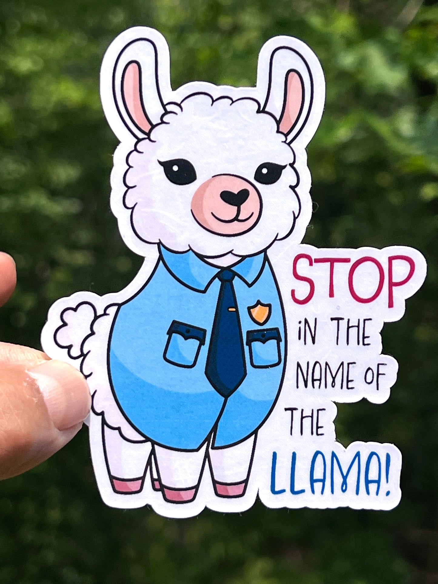 A sticker depicting a cartoon llama wearing a blue police officer shirt, with the text 'STOP IN THE NAME OF THE LLAMA!'