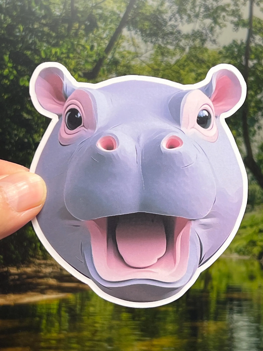 A stylized, colorful vinyl sticker of a baby pygmy hippopotamus head like the famous Moo Deng