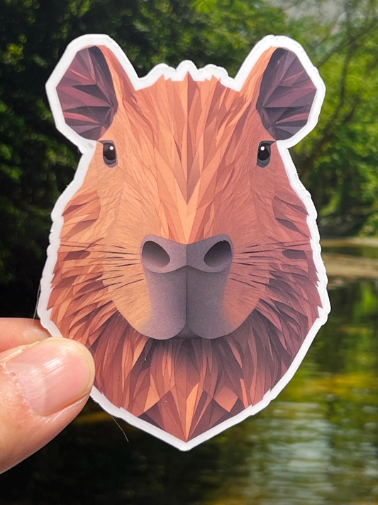 Sticker of a capybara head in a geometric paper cut out style