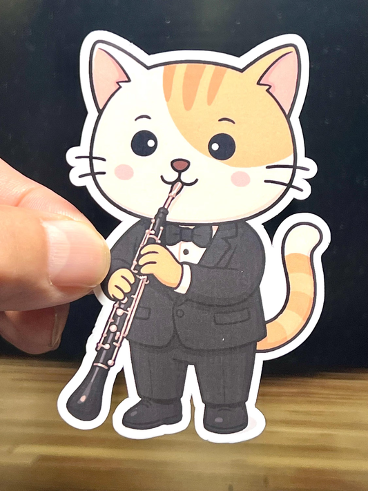 Kawaii design cartoon cat in a tuxedo playing an english horn vinyl sticker