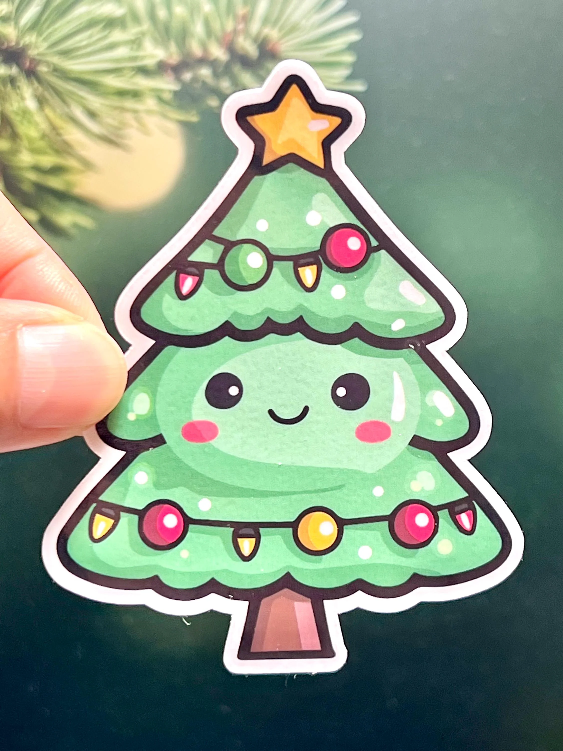 A sticker of a cute smiling Christmas tree with a happy facial expression, decorated with colorful ornaments and a star at the top.