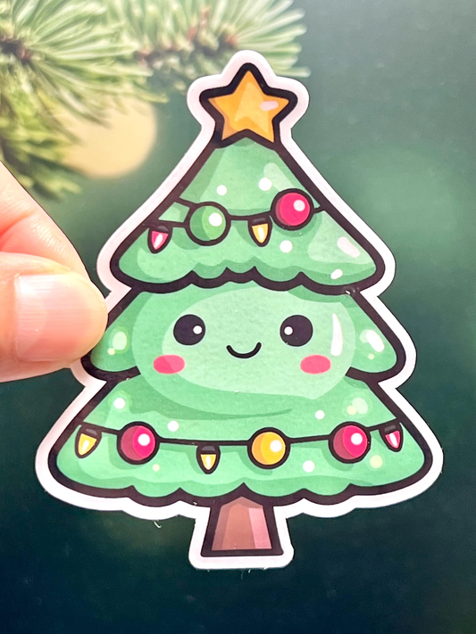 A sticker of a cute smiling Christmas tree with a happy facial expression, decorated with colorful ornaments and a star at the top.