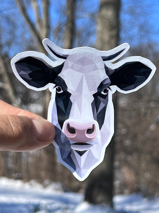A vinyl sticker of a cow's head in a geometric style