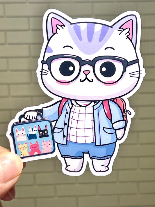 A sticker of a cartoon cat character wearing eyeglasses and carrying a lunch box with a school theme.