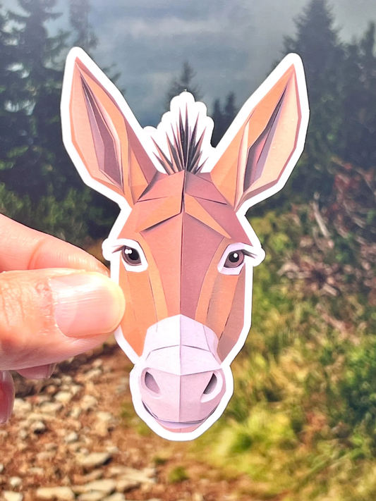 A sticker of a donkey head in a distinctive geometric- paper cut style