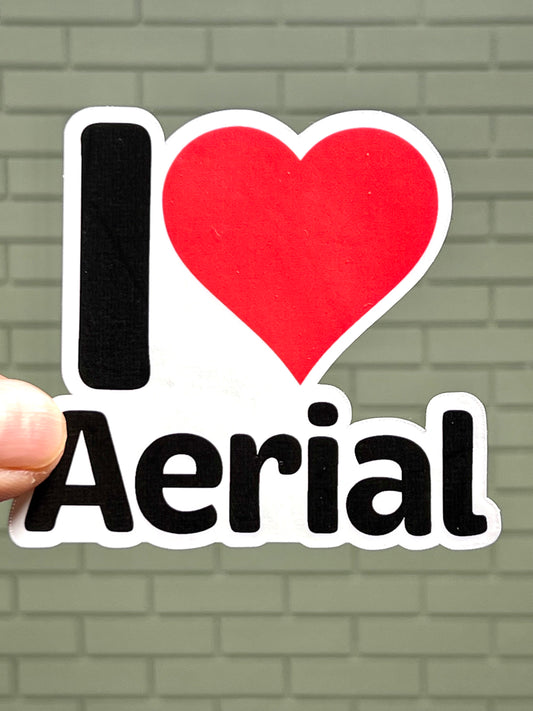 A sticker with the text 'I LOVE AERIAL' and a heart symbol