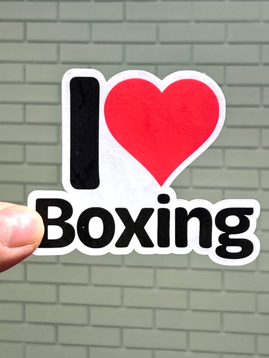 A vinyl sticker with the text 'I LOVE BOXING' and a heart symbol representing the word 'love'.