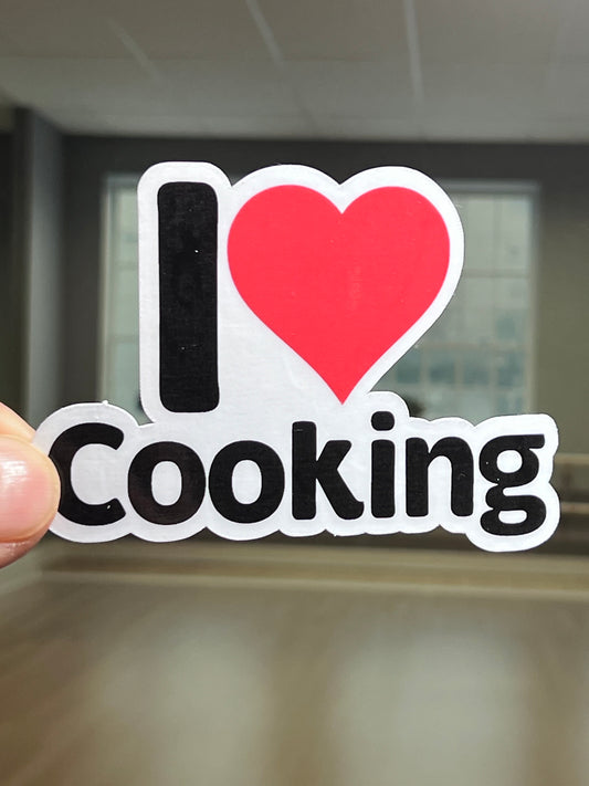 A vinyl sticker with the text 'I LOVE Cooking' and a heart symbol replacing the word 'love'.