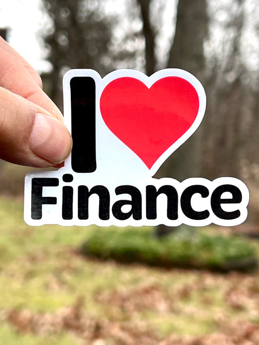 A vinyl sticker with the text 'I FINANCE' and a red heart symbol replacing the word 'love'.