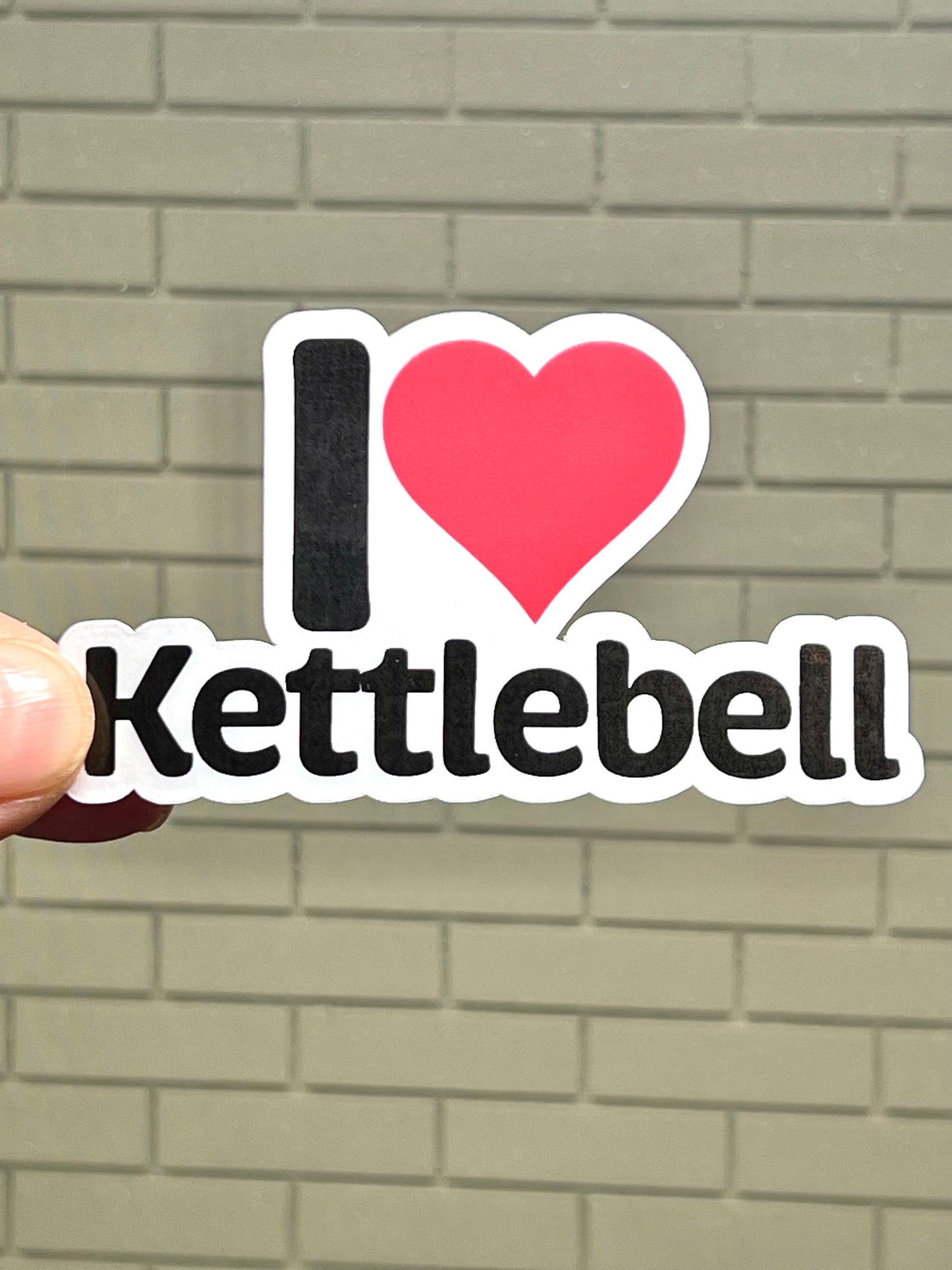 A vinyl sticker with the text 'I love Kettlebell' and a heart symbol.