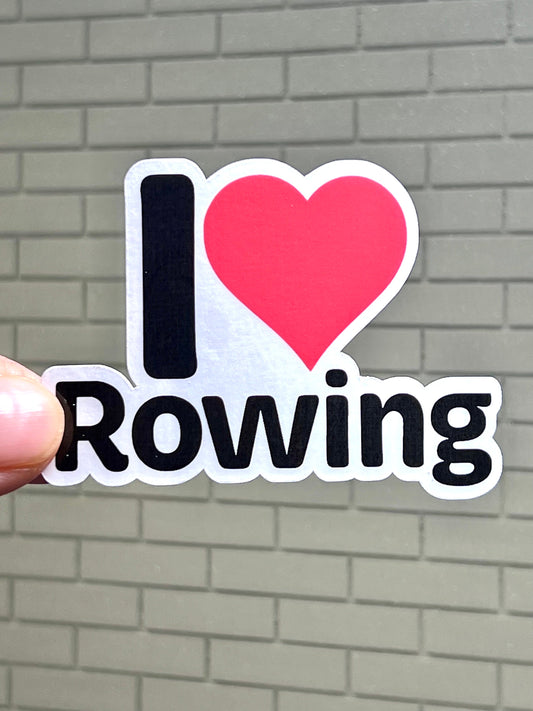 A vinyl sticker with the text 'I heart ROWING' and a red heart symbol replacing the word 'heart'. 