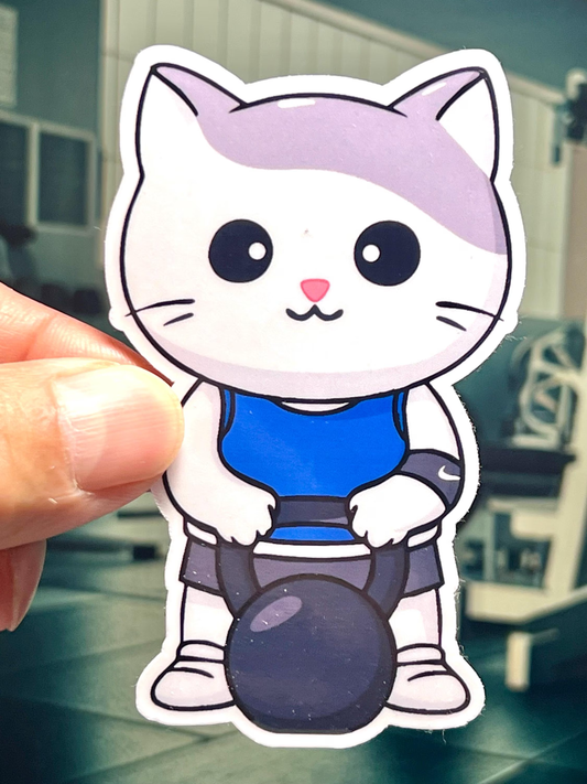 Sticker of Cartoon cat character holding a kettlebell with a blurred background