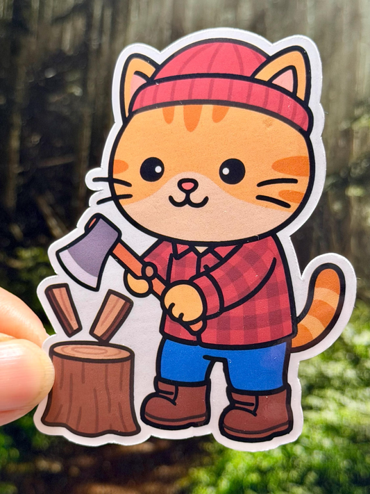 Sticker of a cartoon lumberjack cat in a red cap and plaid shirt chopping wood with an axe.