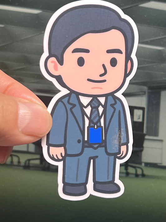 Cartoon sticker of Mark S from the show Severance wearing suit.
