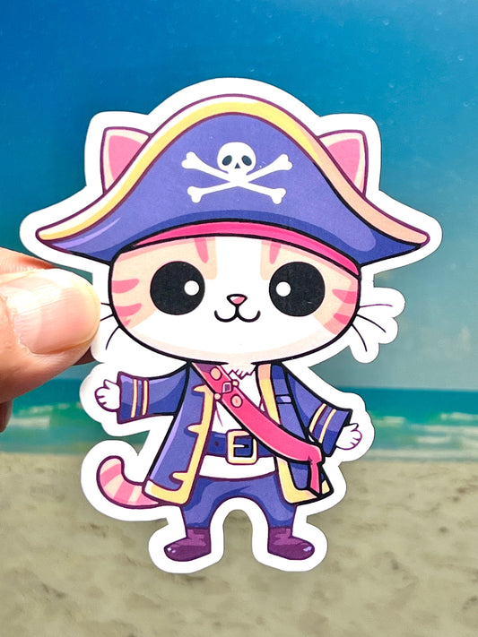 A sticker of a cute, cartoon-style cat wearing a pirate captain's outfit, including a pirate hat with a skull design and a captain's coat.