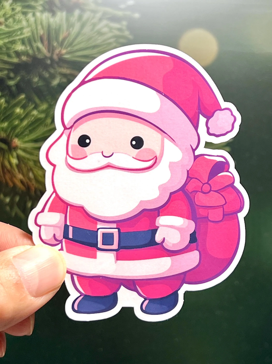A sticker of a kawaii design Santa Claus with a red outfit and a sack of gifts.