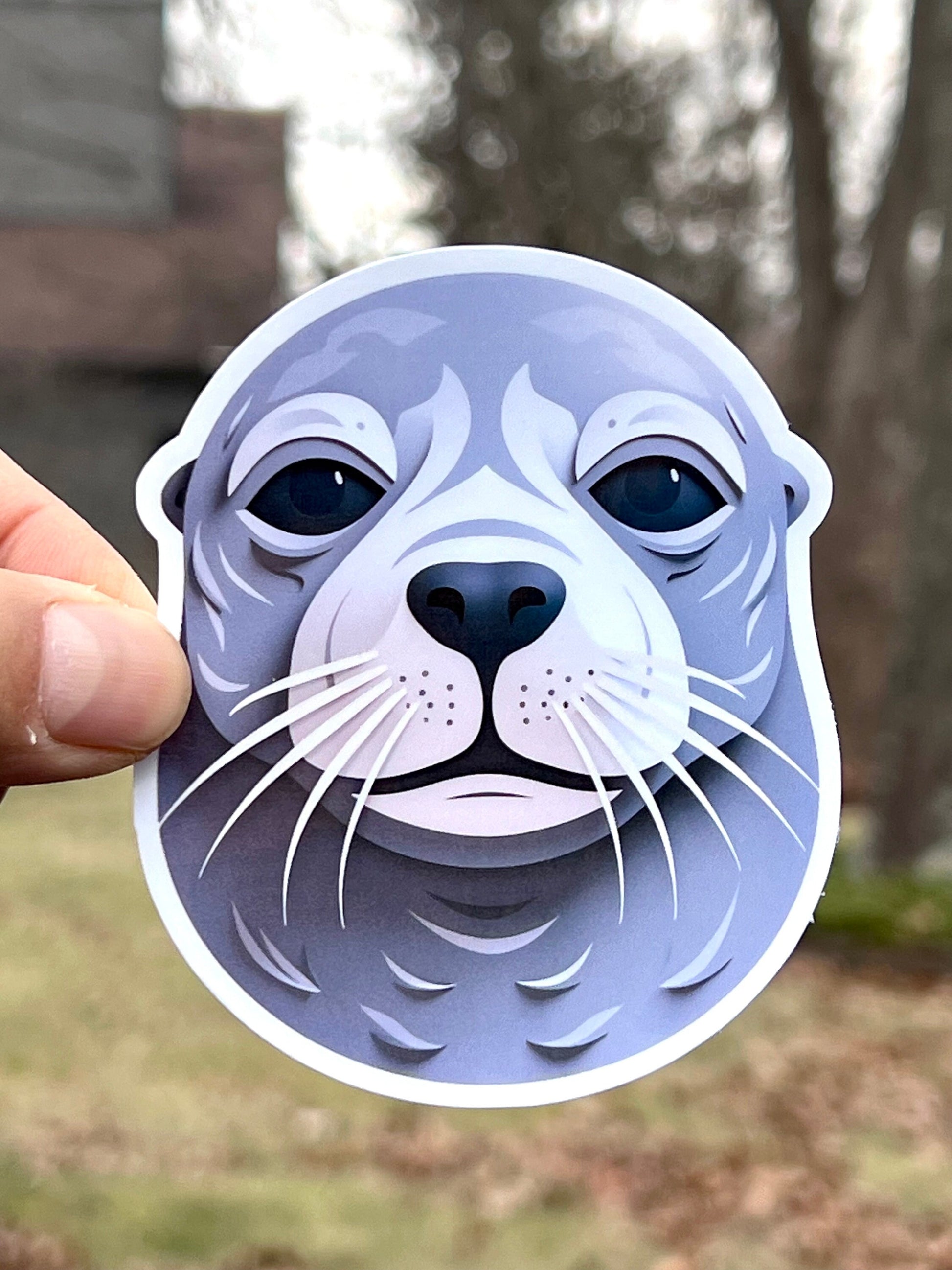 A vinyl sticker of a seal head with a geometric design