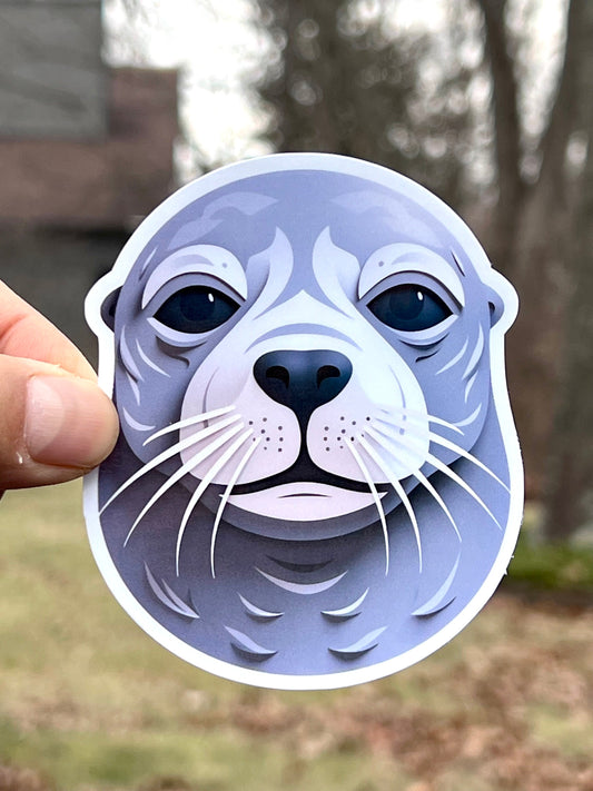 A vinyl sticker of a seal head with a geometric design
