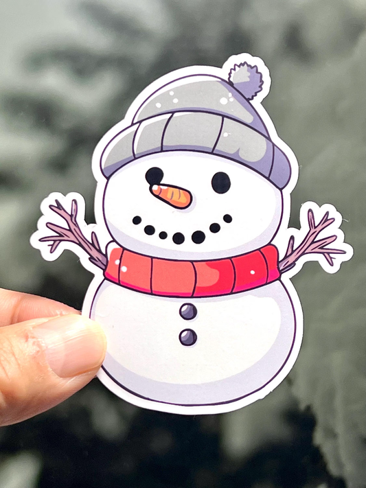 Cute sticker of a snow man with twig arms, charcoal eyes, carrot nose and wearing a winter hat.