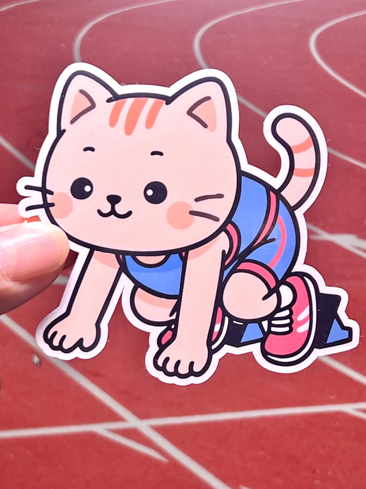 Sticker of cat sprinter running track. Cat is crouched with feet on the starting blocks
