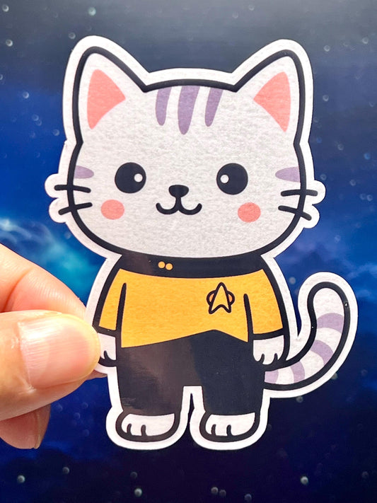 Cartoon cat sticker with a Star Trek the next generation yellow uniform 