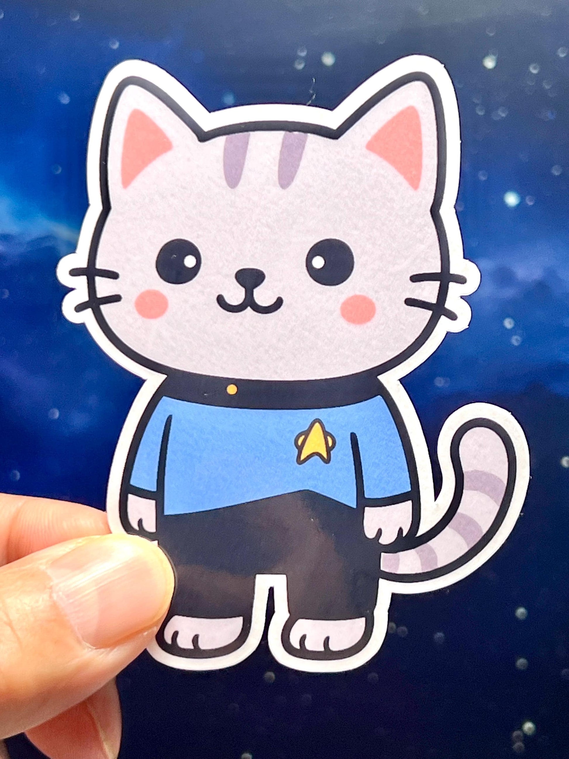 Cartoon cat sticker with a blue Star Trek The Next Generation Uniform