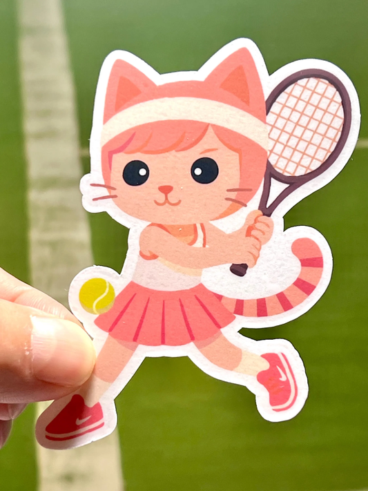 A sticker depicting a cartoon image of a cat wearing a pink tennis outfit hitting a tennis ball