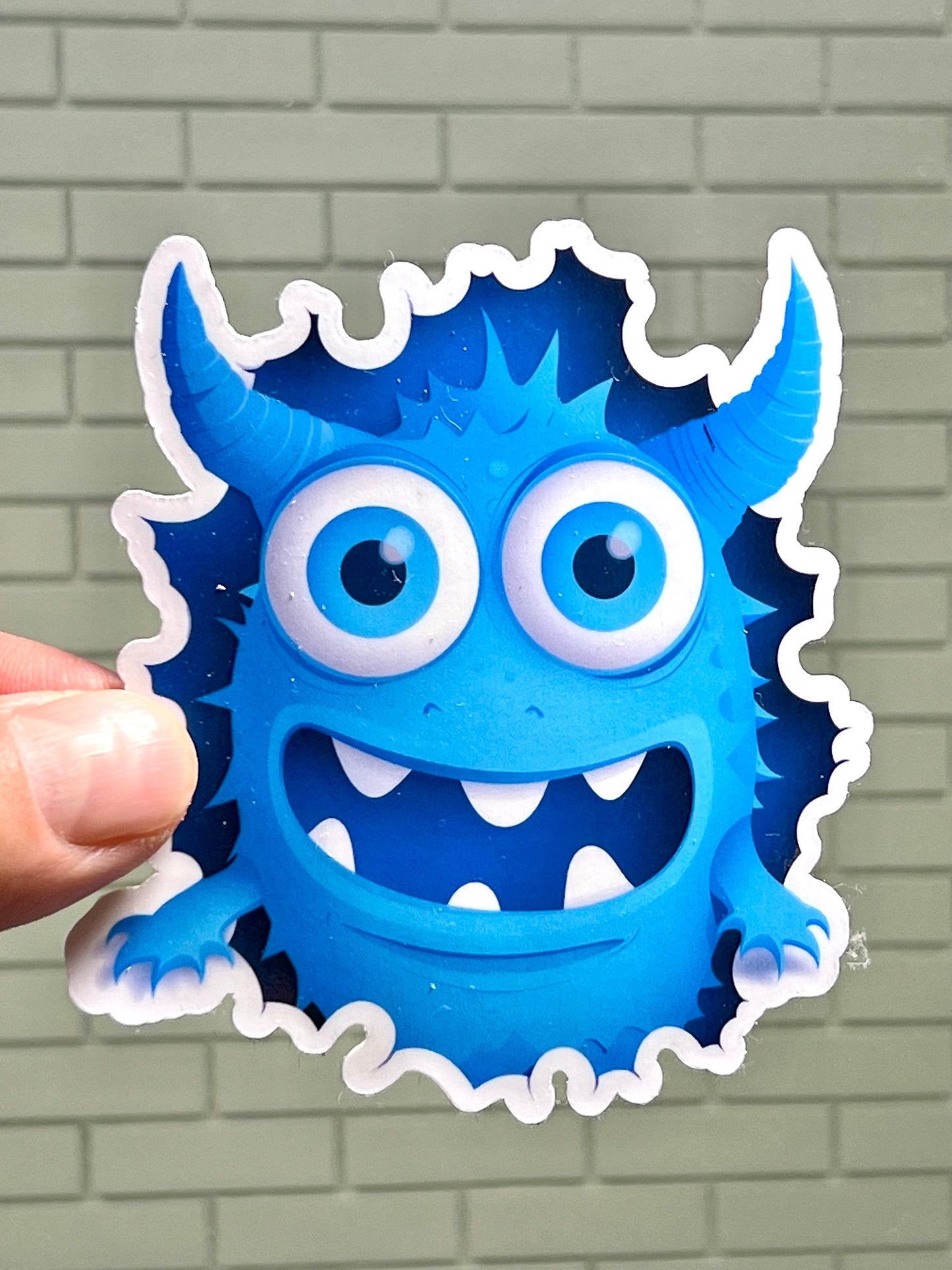Blue Monster Punching Through Wall Vinyl Sticker