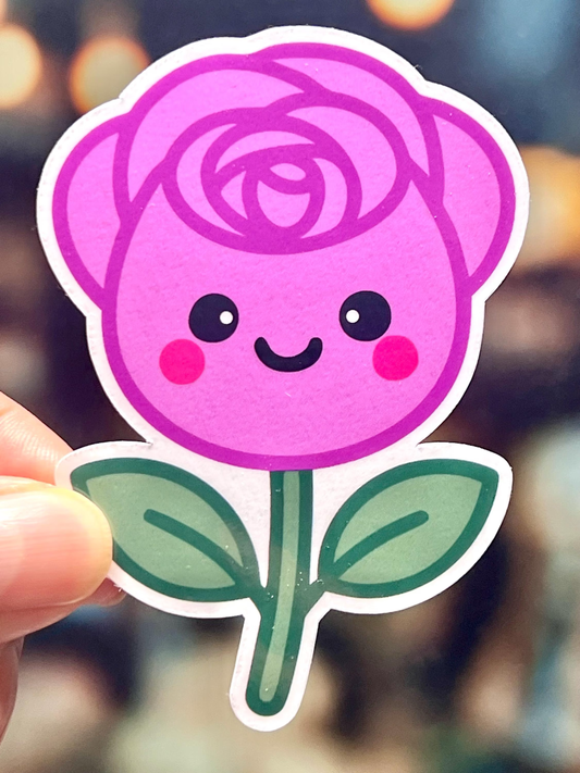 Sticker of a pink rose with a smiling face, kawaii design.